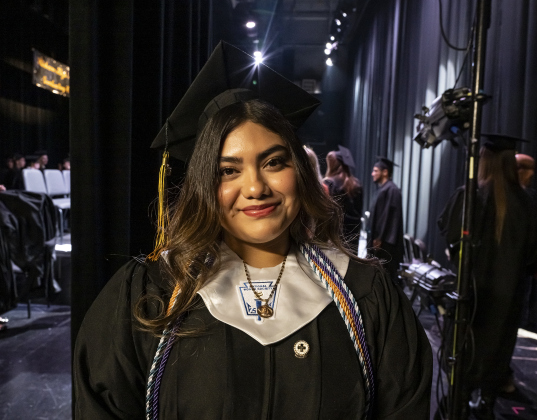 Valedictorian Leslie Hernandez wears a big smile before going onstage with her classmates during the Richarte High School commencement ceremony held at the Klett Performing Arts Center  on Thursday, May 22, 2025. 77 of the 102 seniors walked the stage to receive their diplomas.    Photo by Andy Sharp. 