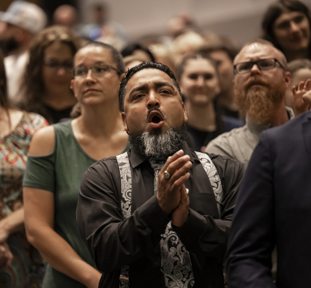 Michael Luna cheers for his son, senior Anthony Luna  during the Richarte High School commencement ceremony.
