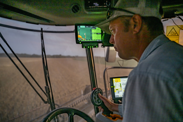 Aaron Martinka guides his equipment through a field  north of Jonah during wheat harvest on Tuesday, May 20, 2025.  Martinka and his helpers are harvesting 700 acres of wheat this season.   Photo by Andy Sharp.  145