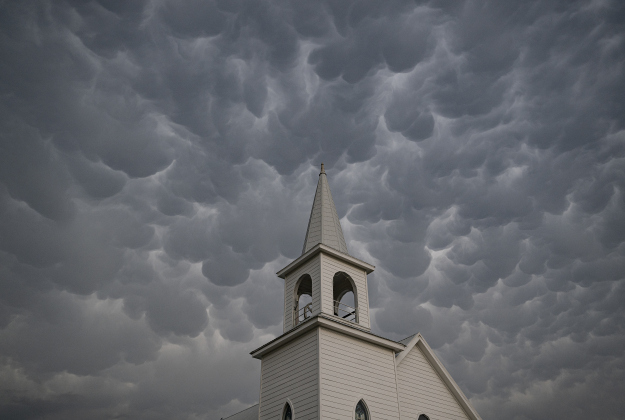 Mammatus clouds form over Saint Peter's Church of Coupland  on Thursday evening,  May 1, 2025.    Photo by Andy Sharp. 