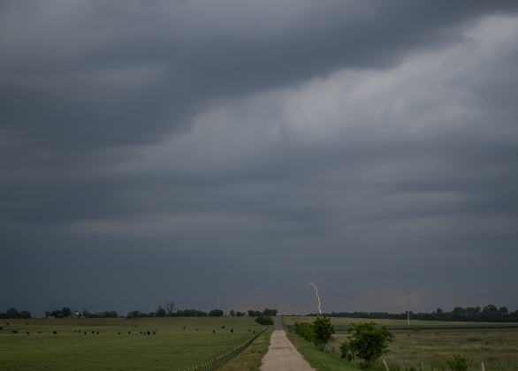 Lightning strikes in the distance in this scene along County Road 456  on Thursday evening,  May 1, 2025.    Photo by Andy Sharp.