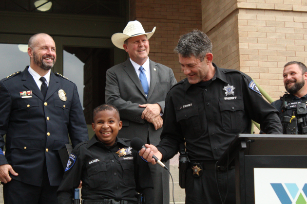 DJ Daniel, joined by Georgetown Police Chief Cory Tchida, far left, Williamson County Sheriff Matt Lindemann, center left, Sheriff Deputy Jeff Combs, center right, and Interim Jarrell Police Chief Pacer Korn on the north side of the courthouse, Monday afternoon.