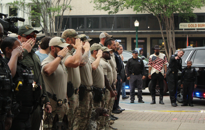 Members of the Williamson County Sheriff’s SWAT Team salute DJ as he makes his way to the courthouse.
