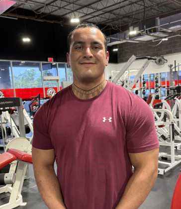 Brennan Eggers, owner of Georgetown Fitness, standing inside his gym. Photo by Abbey Archer