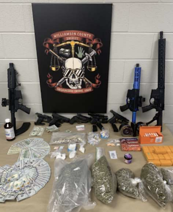 Assorted guns, cash and drugs were found by the sheriff’s office. (Photo courtesy Williamson County Sheriff's Office)