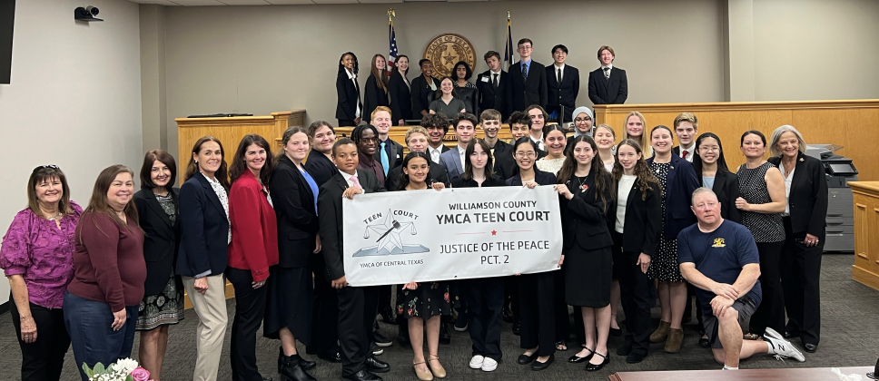 Fourth from the left front row: Justice of the Peace Precinct 2 Angela Williams. Far right front row: Former Justice of the Peace Precinct 2 Edna Staudt. Back row, middle in the judge's chair is Jasmine Wolf. Photo courtesy of Williamson County.