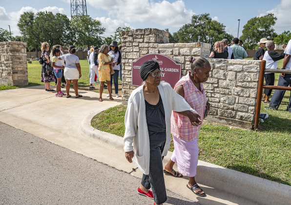 Sisters Eula Scroggins, left, and Cora Marie Espy make their way home after the unveiling of an historical marker at Citizens Memorial  Garden Cemetery during a ceremony held  on Juneteenth, Thursday, June 19, 2025.