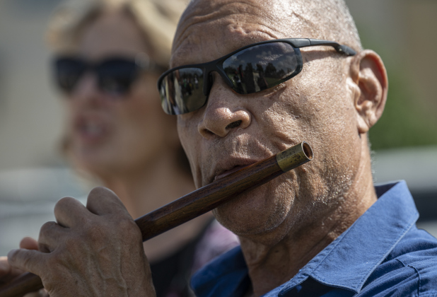 Ruffie London plays his flute during singing of 'This Little Light of Mine' at  the unveiling of an historical marker at Citizens Memorial Garden Cemetery during a ceremony held  on Juneteenth, Thursday, June 19, 2025.