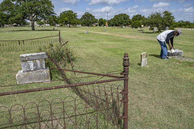 Georgetown Cultural Citizen Memorial Association member Tyrone Adams takes a walk through the grounds to look at gravestones at  the unveiling of an historical marker at Citizens Memorial Garden Cemetery during a ceremony held  on Juneteenth, Thursday, June 19, 2025.