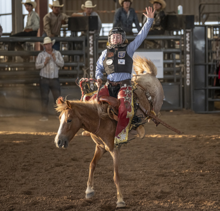 12-year-old Shilow Wilson of Coldspring, Texas competes in saddle bronc riding at  the Bill Pickett Youth Rodeo, held at the Williamson County Expo Center  on Saturday, June 21, 2025.  Now in its second year, the rodeo showcases athletes 18 or younger. The event is coordinated by the Bill Pickett Youth Rodeo Association.     Photo by Andy Sharp.