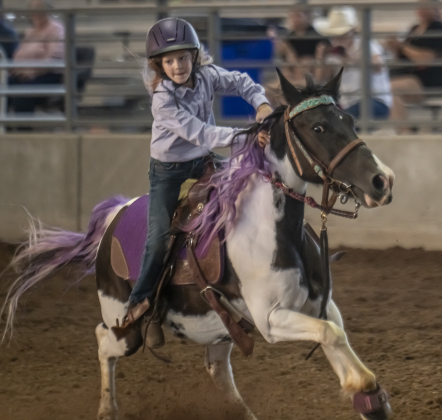 8-year-old Harper Buddin competes in barrel racing at  the Bill Pickett Youth Rodeo, held at the Williamson County Expo Center  on Saturday, June 21, 2025.  Now in its second year, the rodeo showcases athletes 18 or younger. The event is coordinated by the Bill Pickett Youth Rodeo Association.     Photo by Andy Sharp.