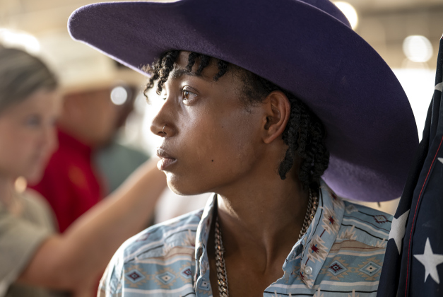 16-year-old Jacki Gayle, a bull rider (the only female in this event) from Odessa, Texas, prepares to carry the American flag into the arena at the start of  the Bill Pickett Youth Rodeo, held at the Williamson County Expo Center  on Saturday, June 21, 2025.  Now in its second year, the rodeo showcases athletes 18 or younger. The event is coordinated by the Bill Pickett Youth Rodeo Association.     Photo by Andy Sharp.