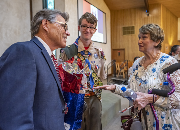 Trevor Suggs, center, listens in as former Texas Governor Rick Perry, left, speaks to Trevor’s grandmother Patty Suggs, right, during his Eagle Scout Court of Honor held at Christ Lutheran Church on Sunday, June 1, 2025. Perry conducted the Eagle Charge and Scout Oath to Suggs. Trevor’s Eagle Scout Service Project was creating an accessible cremation scattering garden at Georgetown’s IOOF Cemetery. The project, valued at over $50,000, was completed last year.
