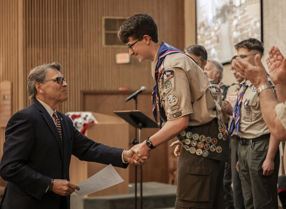 Trevor Suggs is congratulated by former Governor Rick Perry during his Eagle Scout Court of Honor held at Christ Lutheran Church on Sunday, June 1. Perry conducted the Eagle Charge and Scout Oath to Trevor.