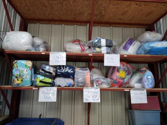 Inside a metal barn off Logan Ranch Road, bedding has been sorted and shelved for delivery.