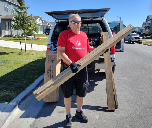 During a September 28 delivery day, Ed Petrere unloads pine pieces that will soon belong to a pair of bunk beds delivered to a family in Jarrell.