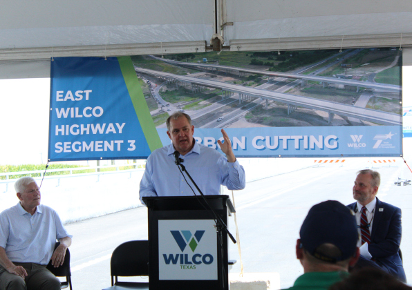 Russ Boles, Williamson County commissioner of Precinct 4, gives his thanks to the many partners to the East Wilco Highway project on Friday, June 20. Photo by Nalani Nuylan.