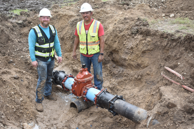 City of Georgetown workers Jim Magiera, left, and Daniel Hernandez, show off their team’s work repairing a broken water line in San Gabriel Park. Photos by Katherine Anthony