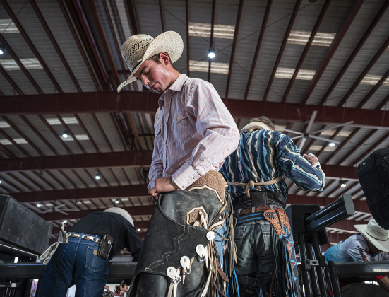 Mason Kight of Dobbin, Texas gets ready to compete in Saddle Bronc Riding at the  75th Annual Taylor Rodeo on Thursday, July 17,2025.  Coordinated by the Taylor Rodeo Association, the three-night rodeo is held at the Williamson County Expo Center.   Photo by Andy Sharp.
