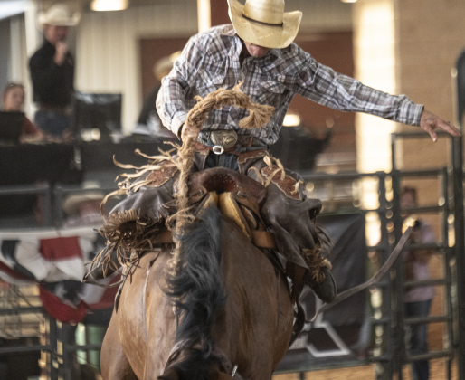Triston Flinn of Hico, Texas competes in Saddle Bronc Riding at the  75th Annual Taylor Rodeo on Thursday, July 17,2025.  Coordinated by the Taylor Rodeo Association, the three-night rodeo is held at the Williamson County Expo Center.   Photo by Andy Sharp.
