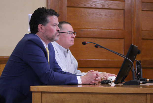 Cameron Glass, front, is joined by Jeff Bradley, behind, to answer questions about how Phase 1 of the new Jail/Justice Center project will roll out, July 22. Photo by Nalani Nuylan.