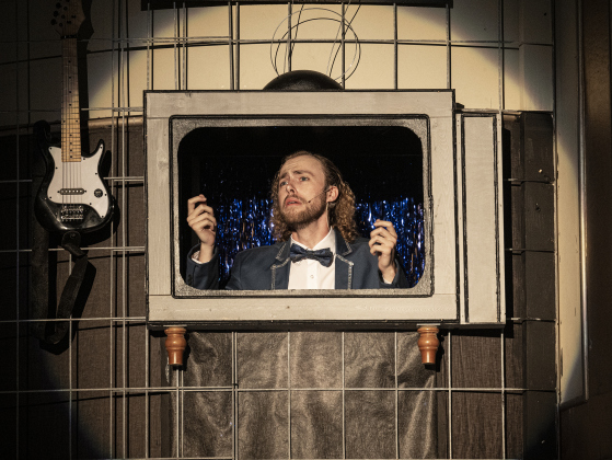 Nathanael Clingan, as Lou Adler, is pictured in a scene from “Beautiful: The Carole King Musical” on Thursday, July 24, 2025.  The production runs through August 31st on the Georgetown Palace Springer Stage.   Photo by Andy Sharp.
