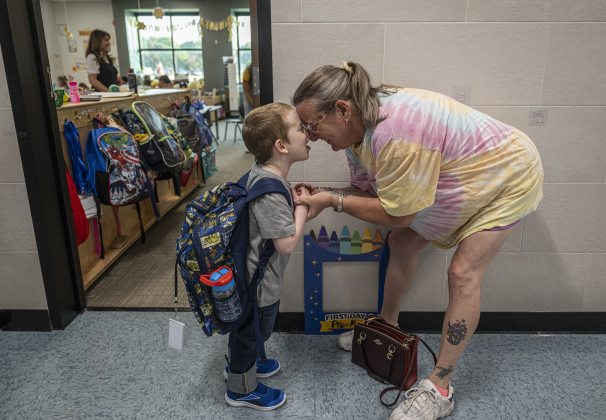 Pre-K student Alex Tafs, 4, spends quiet time with his grandmother Toni Powell before going into his classroom on the first day of school at Annie Purl Elementary School on Thursday, August 14, 2025.  Annie Purl has 650 students enrolled this academic year. Photo by Andy Sharp.  