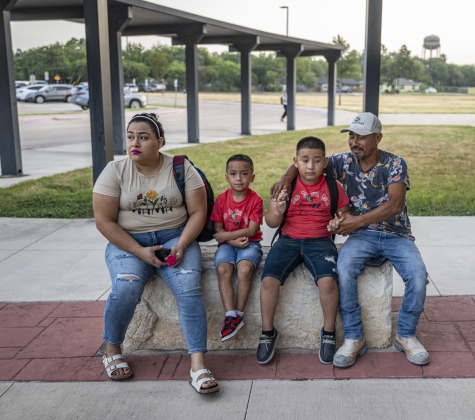 Victoria Vasquez, left, and her husband Guadalupe Gonzalez, right, wait for the front doors to open with their sons Iker Gonzalez, 6, and Gael Santiago Gonzalez, 7, on the first day of school at Annie Purl Elementary School on Thursday, August 14, 2025.  Annie Purl has 650 students enrolled this academic year.    Photo by Andy Sharp.