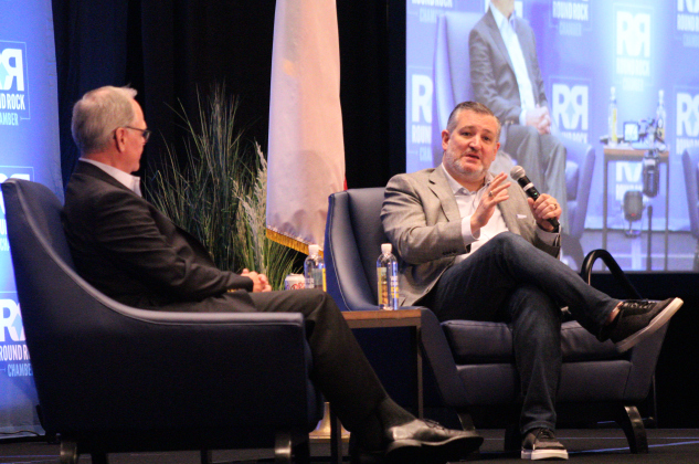U.S. Senator Ted Cruz, right, speaks with John Howard, director of government affairs for Dell Technologies, left, during the Round Rock Chamber of Commerce's Power Lunch at Kalahari Resort and Convention Center on August 19. Photo by Nalani Nuylan.