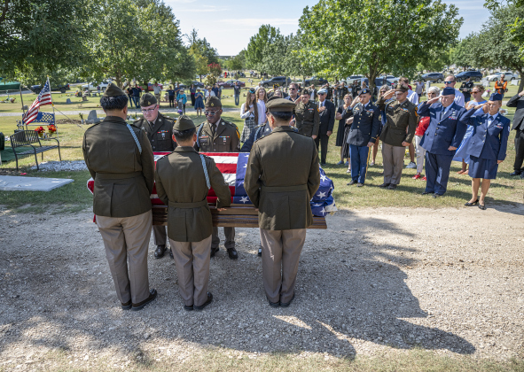 A military honor guard of pallbearers bearing the remains of  First Lt. Charles Woodruff McCook prepare to place the coffin at IOOF Cemetery on Saturday, August 2, 2025.  