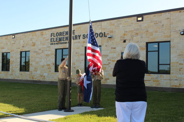Boy Scout Troop 1096 raised the flags during the Florence Elementary School Ribbon cutting.