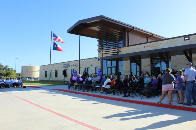 Community members from Florence, including parents, teachers, city council and staff, county officials and businesses, gather at the new elementary school to celebrate its opening.