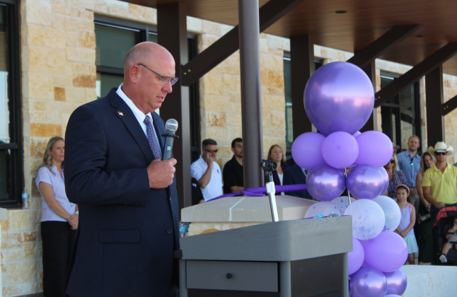Rick Kirkpatrick, superintendent of Florence ISD, gives a speech thanking the Florence Buffalo community for investing in the new FISD elementary school, July 30.