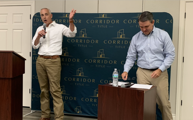 Mayor Josh Schroeder, left, had a conversation with Patrick Rose from Corridor Title about future development in the city, water and wastewater and road projects. (Photo by Kaitlyn Wilkes)