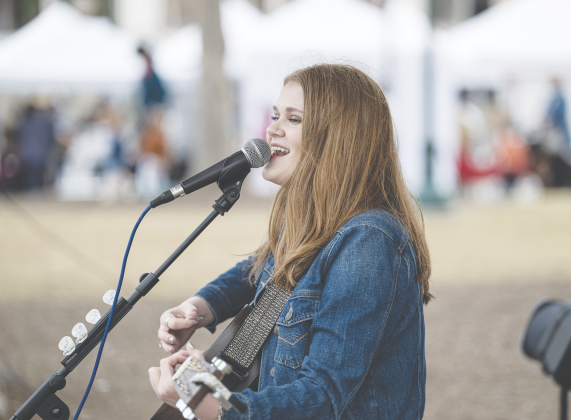 Elle Townley, 16, performs along Seventh Street in downtown Georgetown on Saturday, March 8, during the first Market Days of 2025. Photo by Andy Sharp