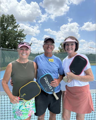 Left to right: Susan Hartsfield, Instructor Doug Olive and Paula Rowe in Sun City. Ms. Hartsfield and Ms. Rowe have taken pickle ball lessons from Mr. Oliver. Photo by Abbey Archer