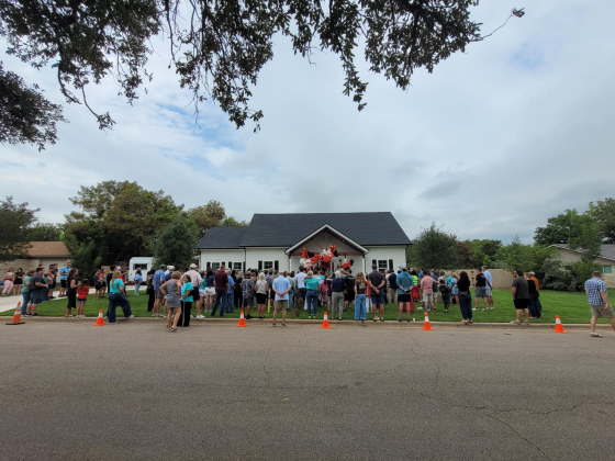 Community members from churches, businesses, CPS and elected officials gather in Georgetown to celebrate the opening of Isaiah 117 House. Photo by Nalani Nuylan.