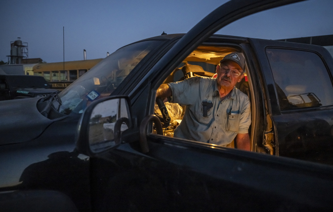 Gin co-owner Clement Strmiska relaxes at the end of a long day’s work  at Waterloo Gin on Tuesday, September 9, 2025.  The gin is along County Road 414 east of Taylor.   Photo by Andy Sharp.