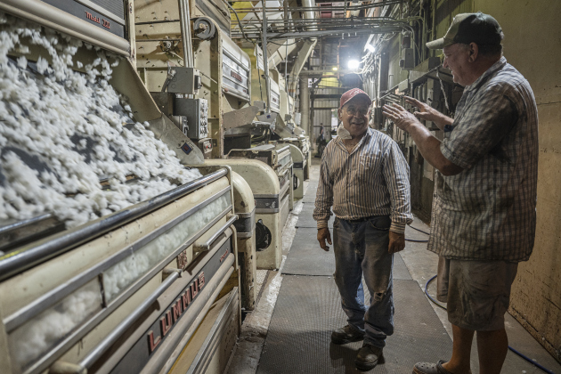 Tony Espinoza, left, chats with gin co-owner David Woollett at Waterloo Gin on Tuesday, September 9, 2025.  The gin is along County Road 414 east of Taylor.   Photo by Andy Sharp.