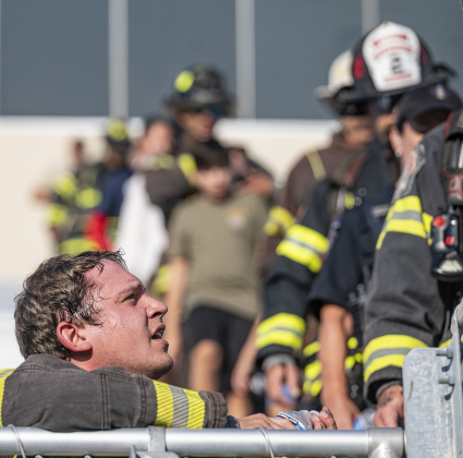 Georgetown Fire Department firefighter Dylan Otto takes a few moments to rest before continuing his walk during the Memorial Stair Climb  on Thursday, September 11, 2025.