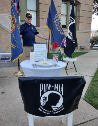 This chair and table, empty except for symbolic place settings, is meant to remind Americans of servicemen and women taken as prisoners of war or still listed as missing in action.