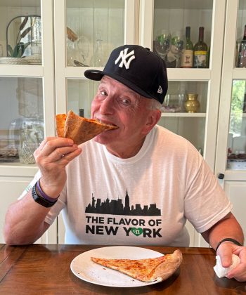 New York pizza aficionado Tom McCabe tries a slice from Niki’s Pizza & Pasta. 