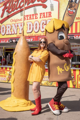 Fletcher’s co-owner Amber Fletcher with the company’s mascot Mr. Corny at the State Fair of Texas.  Photo courtesy Thomas Garza