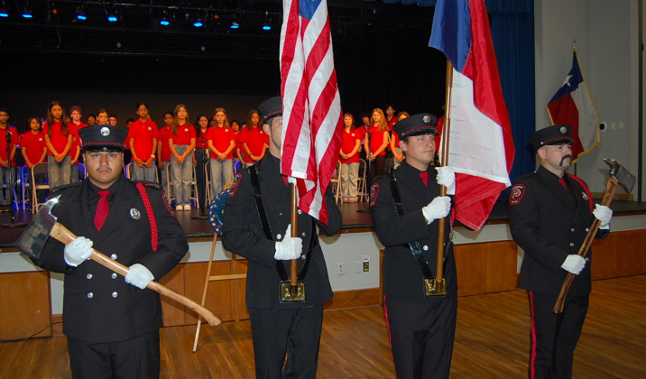 The Georgetown Fire Department and Police Department Joint Color Guard present the colors at the start of the event.