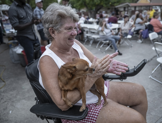 Jackie Bradley and her dog Jaelea enjoy the evening at the National Night Out observance held at the Georgetown Housing Authority’s Stonehaven site  on Tuesday, October 7, 2025.  Photo by Andy Sharp.