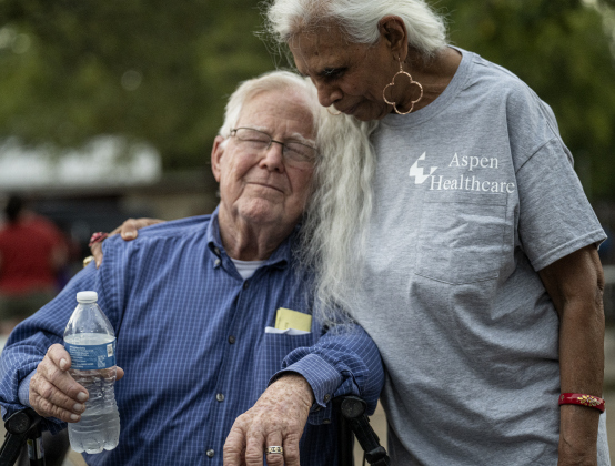 Joe Vicars, 90, left, shares a few quiet moments with Agnes Fernando  at the National Night Out observance held at the Georgetown Housing Authority’s Stonehaven site  on Tuesday, October 7, 2025.  Photo by Andy Sharp.