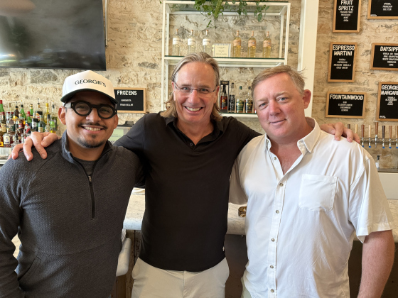 Area manager Brandon Sanchez with owners Matt Luckie and Shane Stark— standing together at the restaurant’s bar. Photo by Abbey Archer