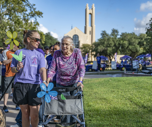 Melisa Zaversnik, left, walks with her mother-in-law Mary Zaversnik, two  of 500-600 participants in the Walk to End Alzheimer’s, held at Southwestern University on  Saturday morning, October 18, 2025.  The event was coordinated by the Alzheimer’s Association Capital of Texas Chapter.   Photo by Andy Sharp.