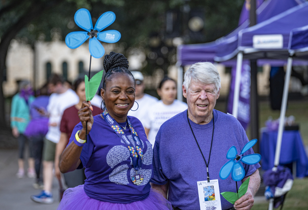 Randi Meacham, left, Memory Care Director at Hacienda At Georgetown, walks with Jerry V during the Walk to End Alzheimer’s at Southwestern University on Saturday, October 18, 2025.  They were among the 500-600 participants walking this morning.   The event was coordinated by the Alzheimer’s Association Capital of Texas Chapter.   Photo by Andy Sharp.