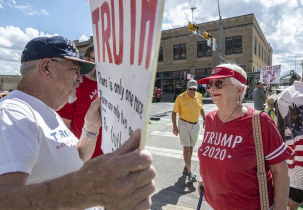 Mike Isbell and his wife Frieda offered another opinion, support of  the current administration  during a “No Kings” demonstration in downtown Taylor on on Saturday afternoon,  October 18, 2025. Although their  protest was quiet, they were heckled by a number of attendees.   The crowd was approximately 300, mostly gathered at 2nd and Main Streets.  Photo by Andy Sharp.